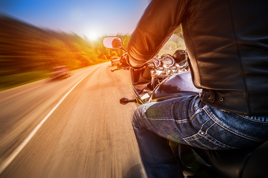 CA Motorcycle Insurance - riding down the road fast